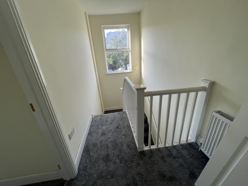 Lot: 33 - FREEHOLD INVESTMENT ARRANGED AS TWO FLATS - General view of top flat landing and stairs